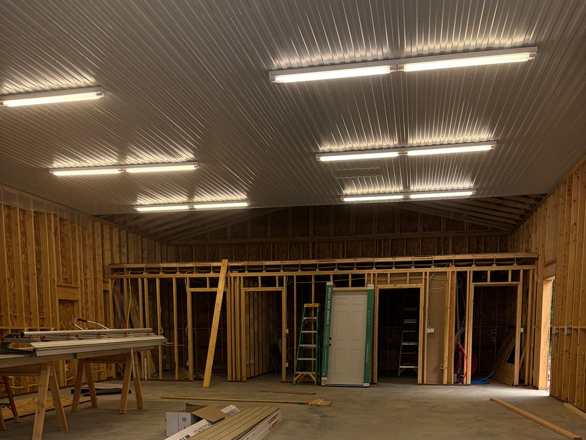 LED shop lighting installed in a newly framed pole barn